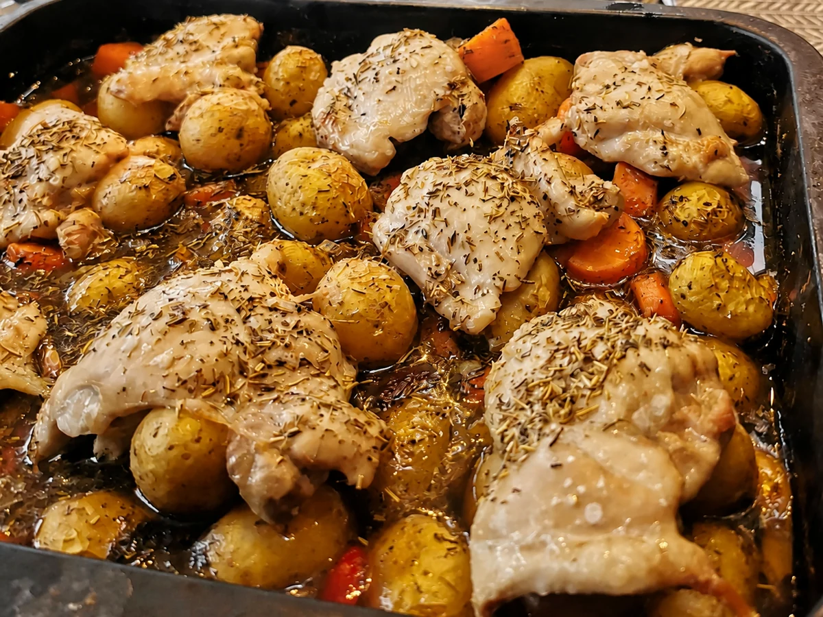 Finished chicken traybake with roasted chicken, potatoes and carrots